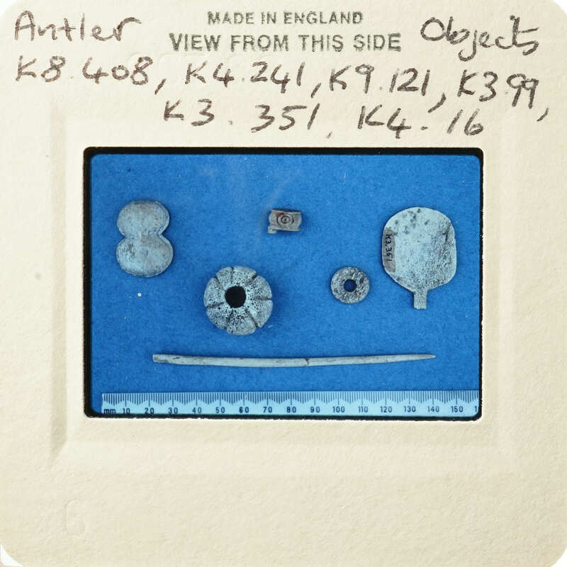Small metal objects on blue background with labels and measurements.