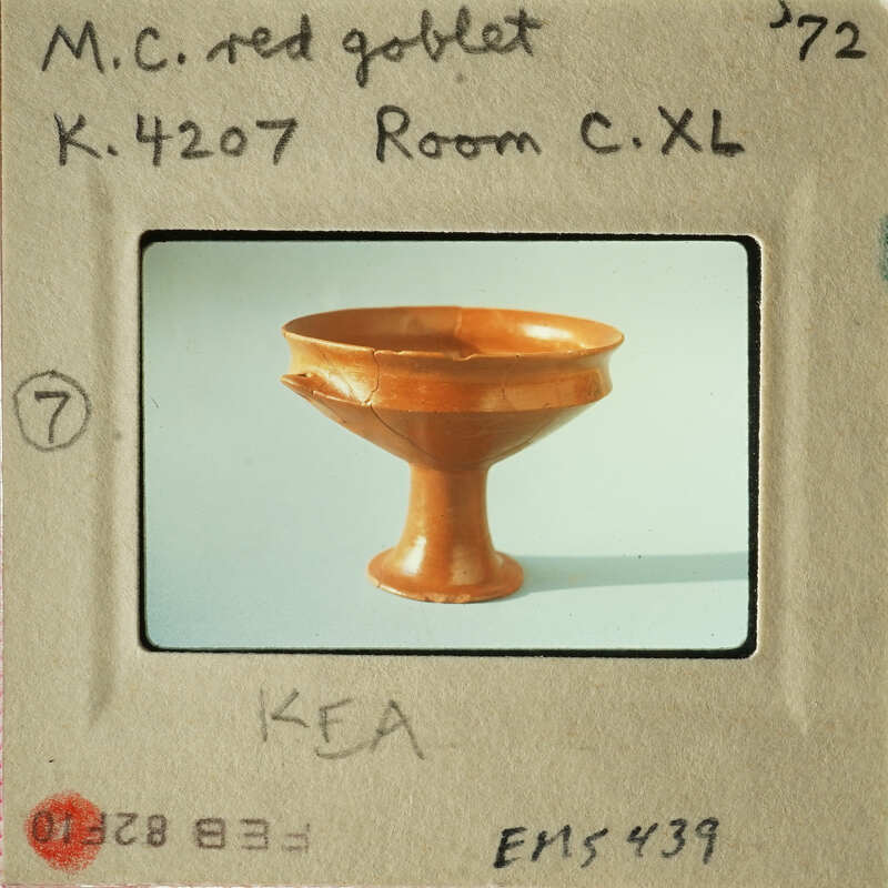 Old photograph of an antique bowl with a label on a cardboard mount.