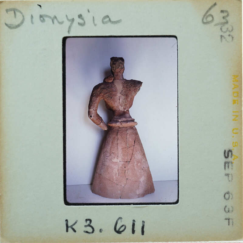 Detail of almost complete terracotta figurine from the back minus right arm.