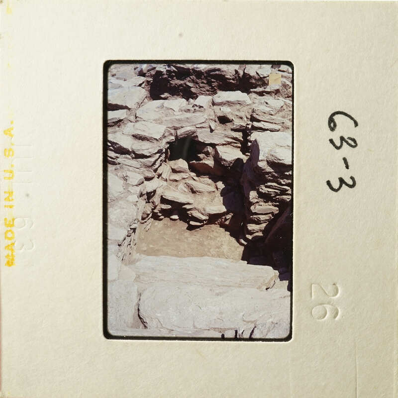 Old stone ruins with natural formations and shadows.