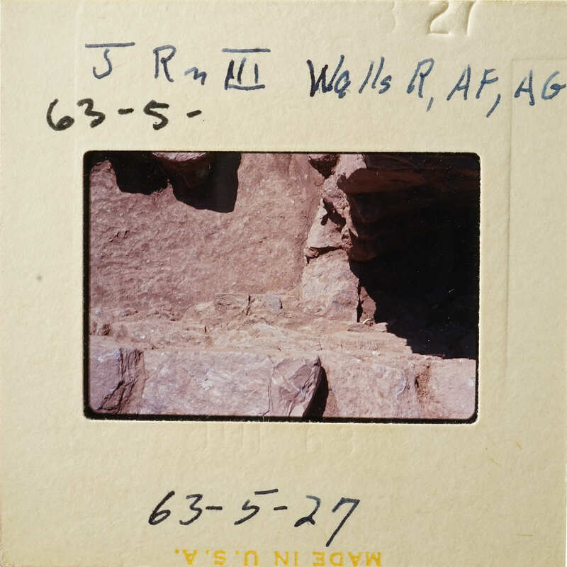 Rocky cliff with layers and crevices, photographed on film, dated May 27, 1963.