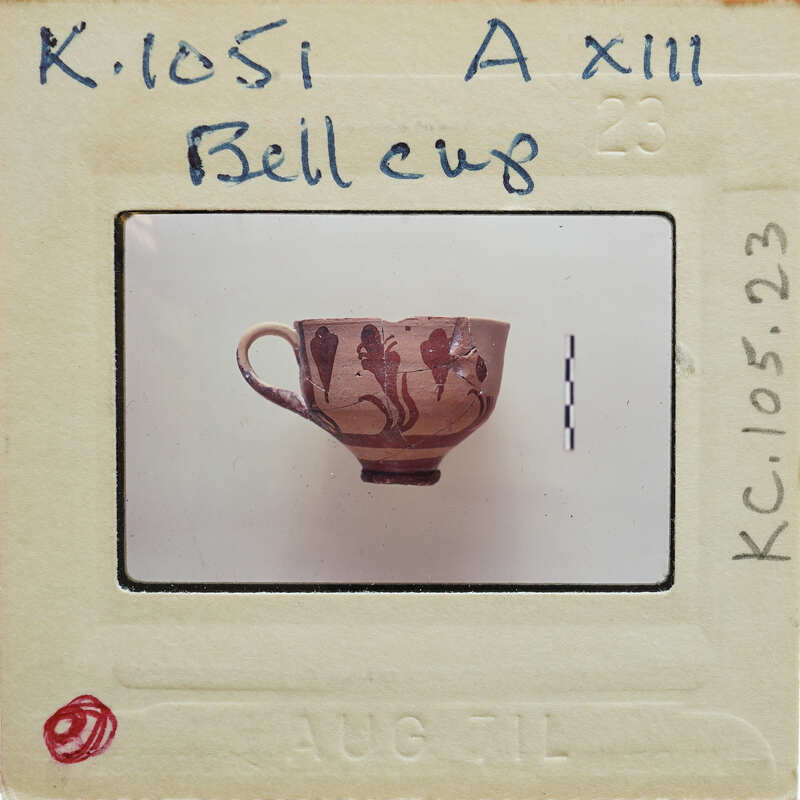 Ceramic mug with a handle (K.1051), in profile on a white surface.