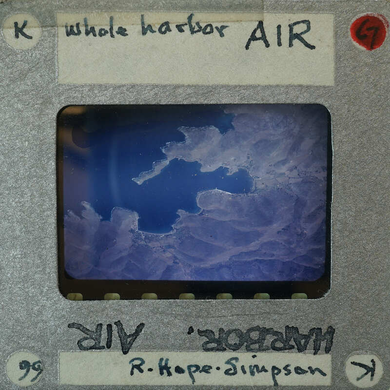 Aerial view of harbor of Kea with landmass.