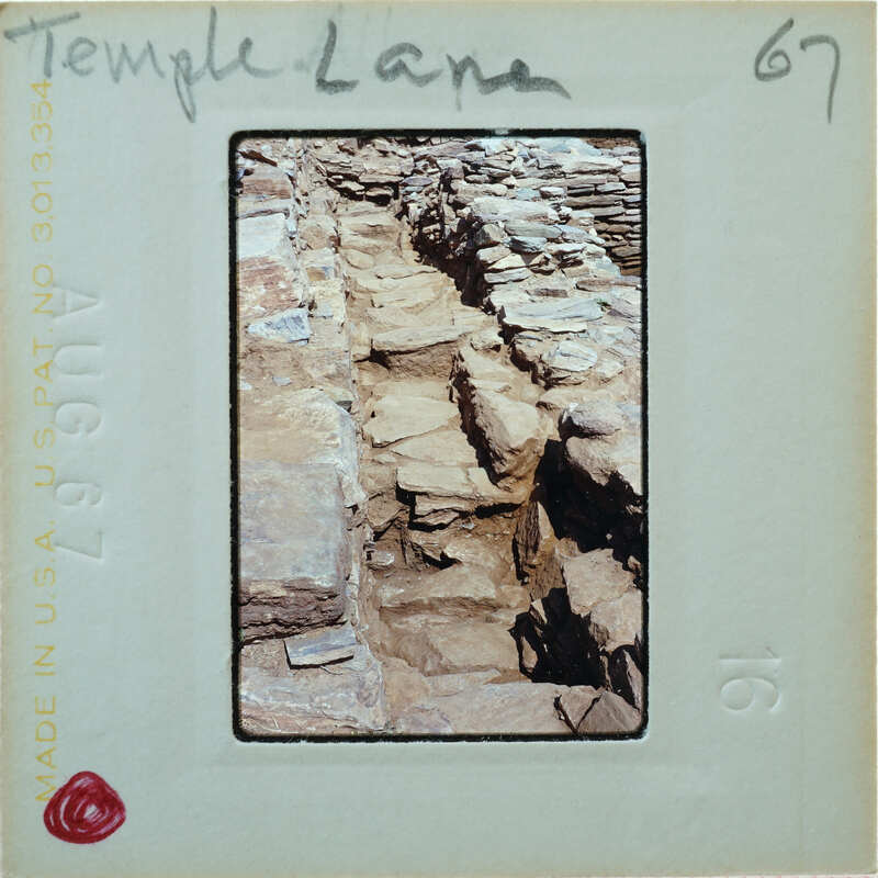 Stone walls in parallel with stone pavement between.