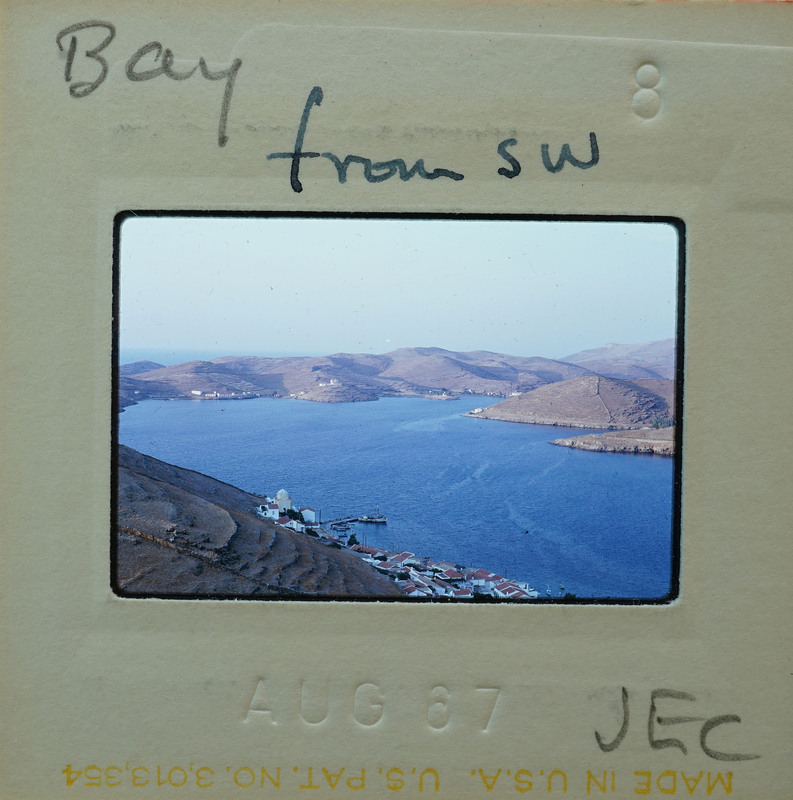 Photo of a coastal landscape with a body of water, hills, and buildings, taken on August 17, 1987.