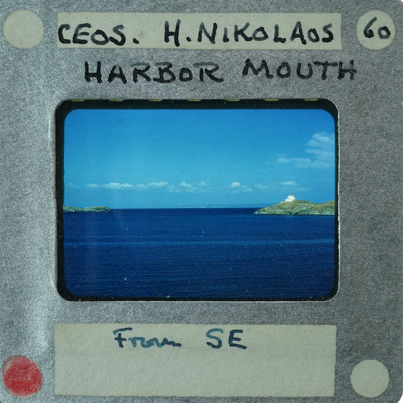 A vintage film strip with a picture of the ocean and islands on it.