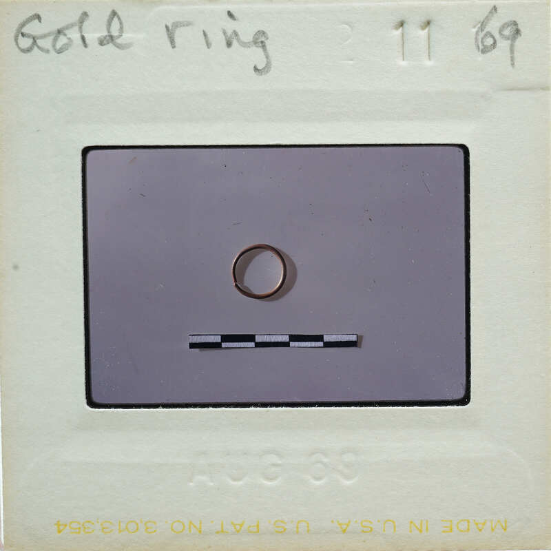 A ring on a piece of paper with writing and numbers around it.
