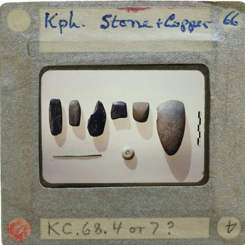A slide of a collection of stone and metal objects with labels.