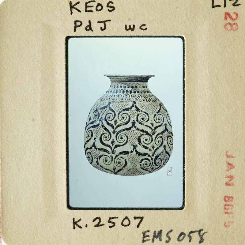 Decorative vase with swirling patterns on an antique postcard.