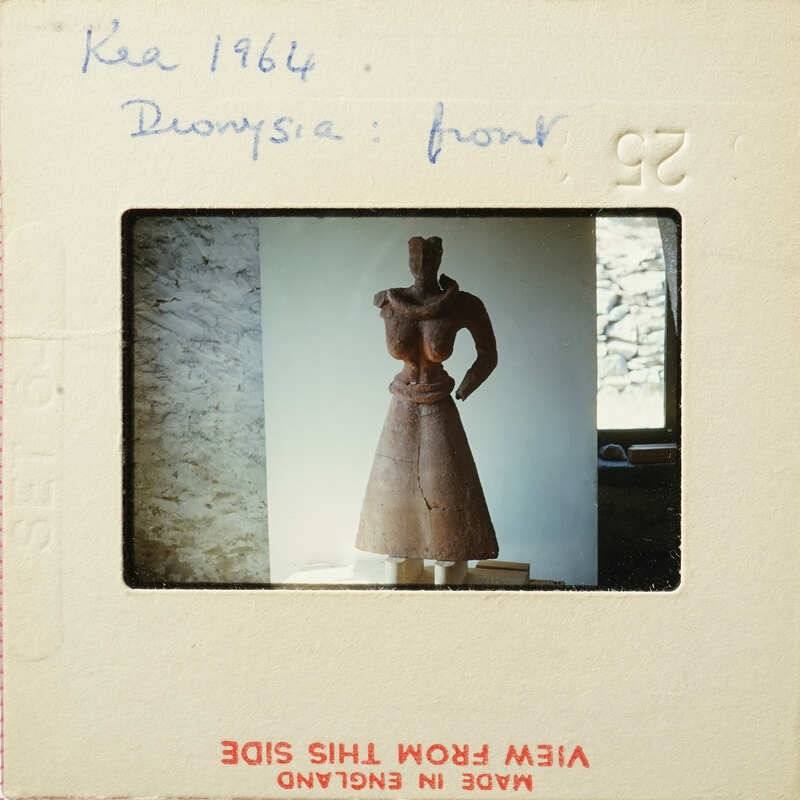 Small clay figurine on display.