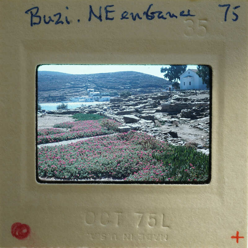 Photo of a scenic landscape with pink flowers, rocks, and water, taken on October 7, 1976.