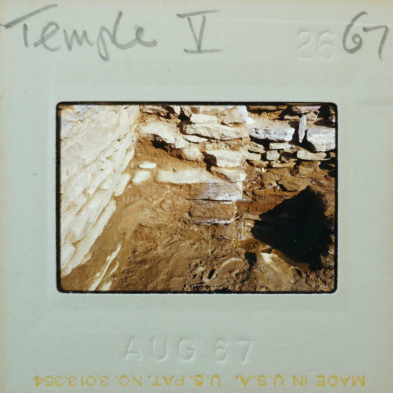 Excavated wall with flooded interior.