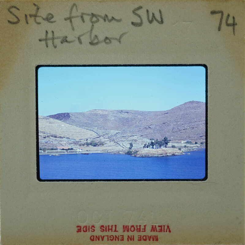 A vintage photograph of a harbor with mountains and water, labeled "Site from SW Harbor".