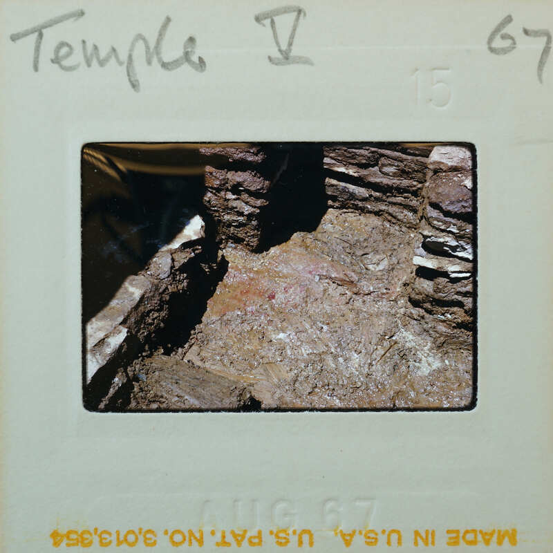 Stone walls and muddy floor.