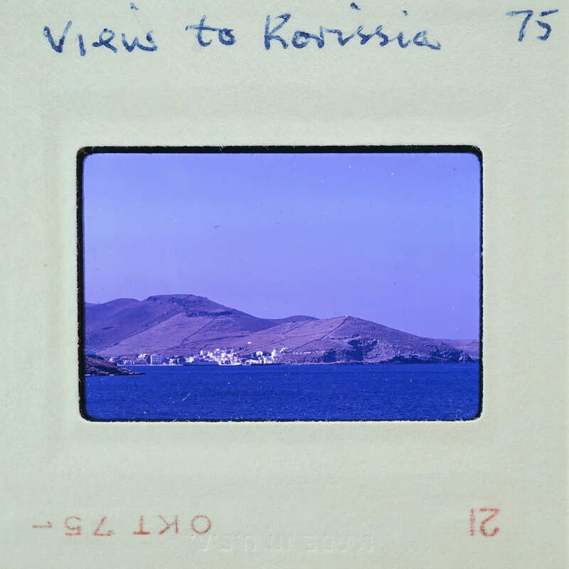 Old photograph of a scenic view with mountains and water, labeled "Views to Corfu".