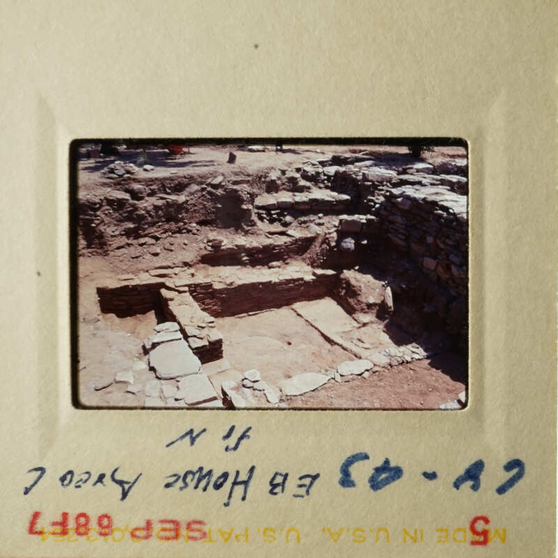 This photo shows an archaeological site with stone ruins, taken from a high angle.