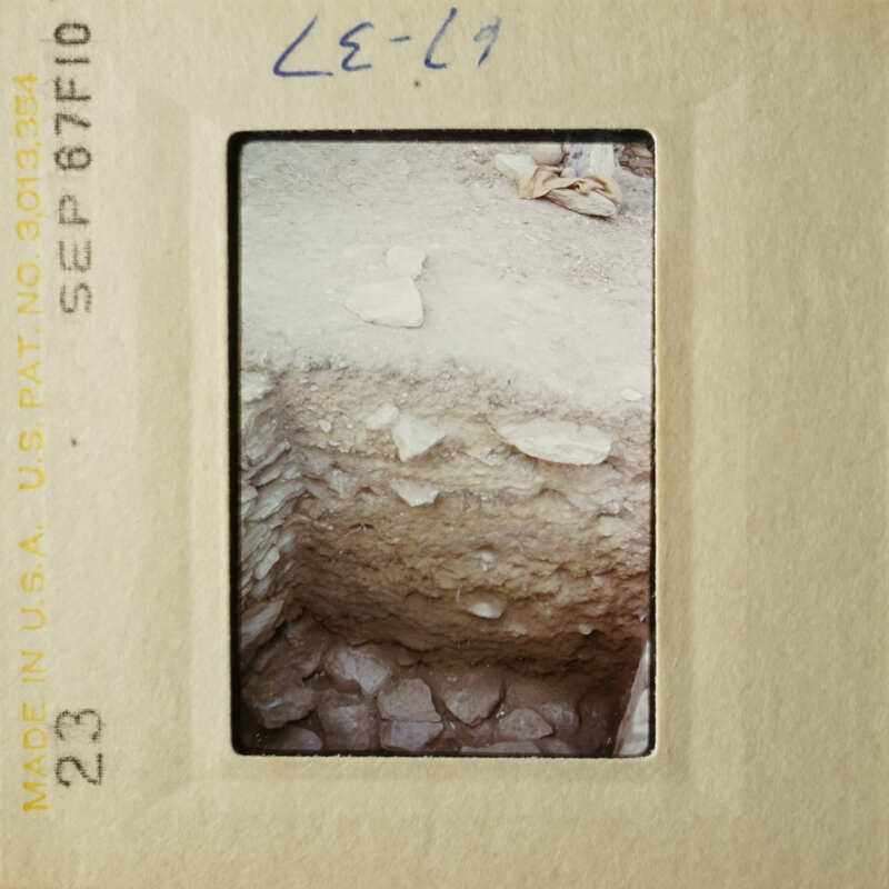 A photograph of an excavation site with exposed soil layers, taken on September 7th, 1976.