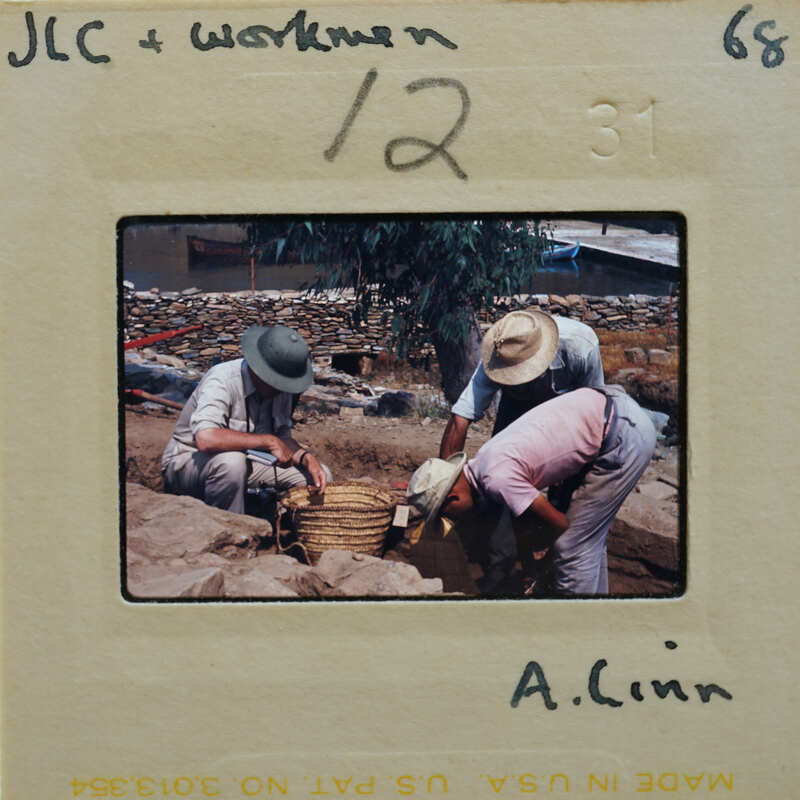 A slide of three people excavating.