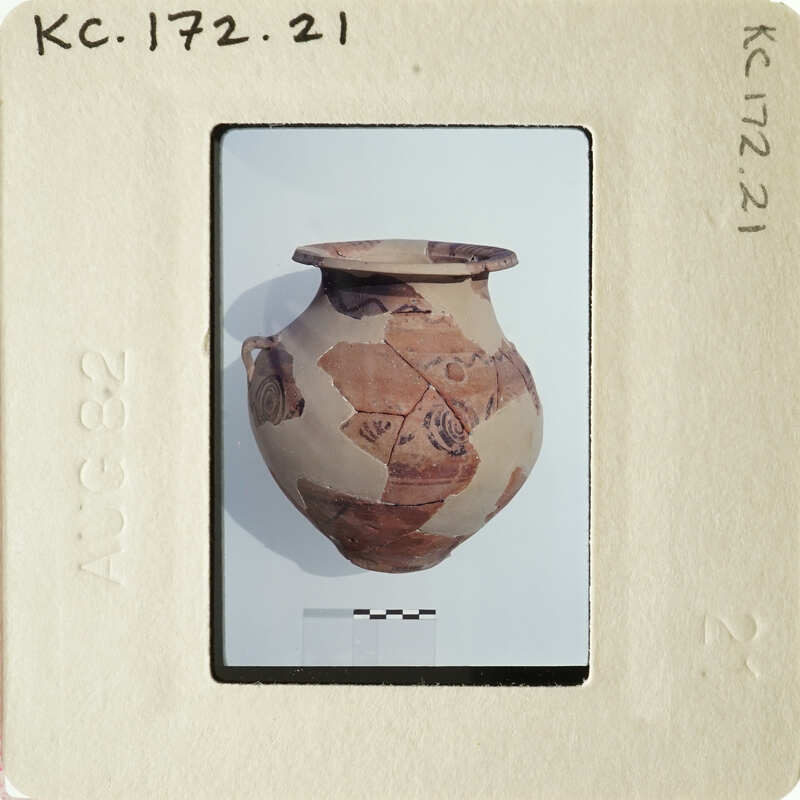 Ancient vase with intricate designs on display.