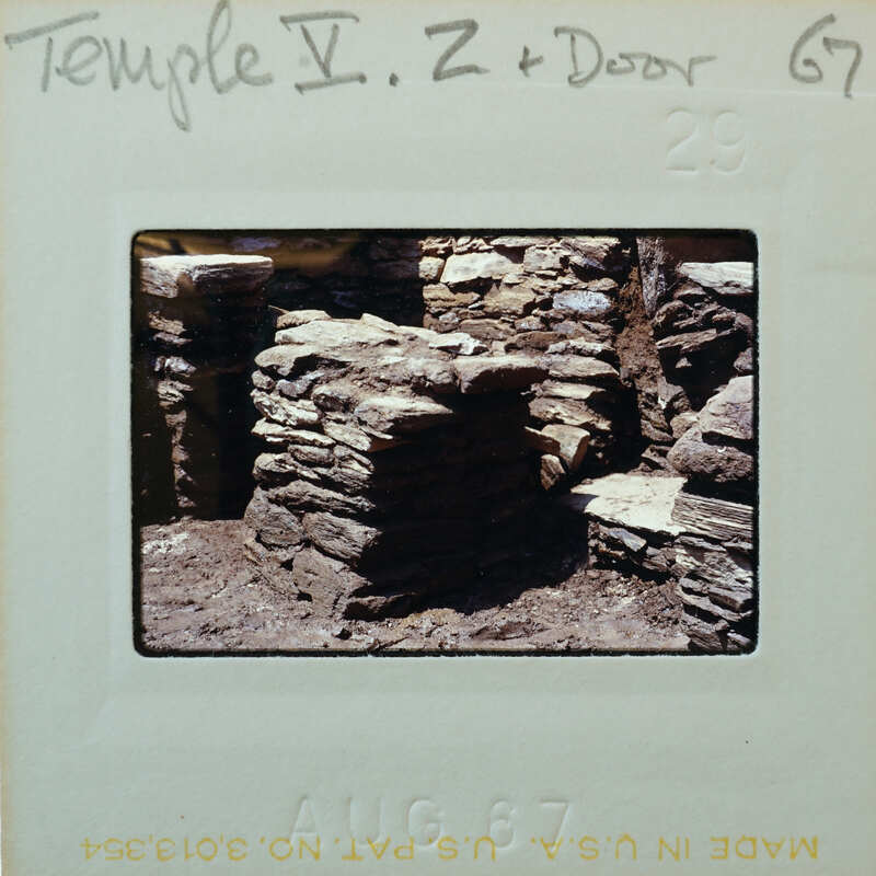 Stone structure with doorway and threshold.