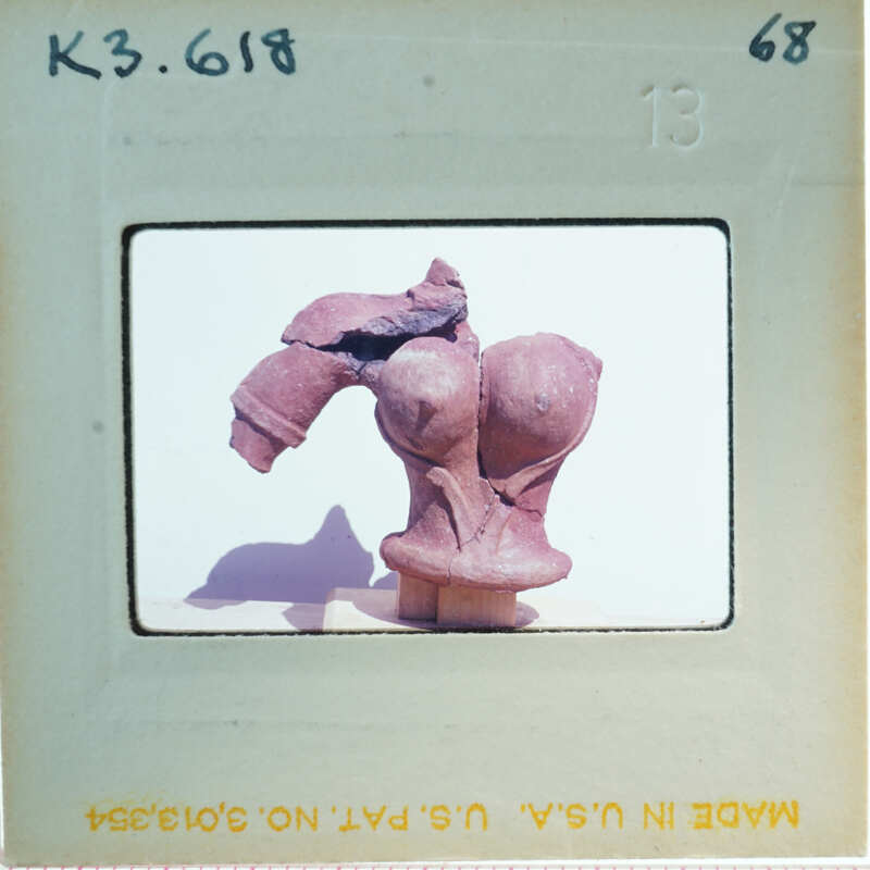 Terracotta figurine torso missing right arm.