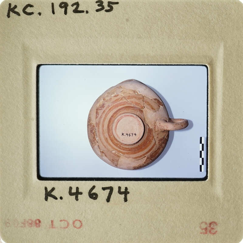 Ancient artifact with concentric circles on display.