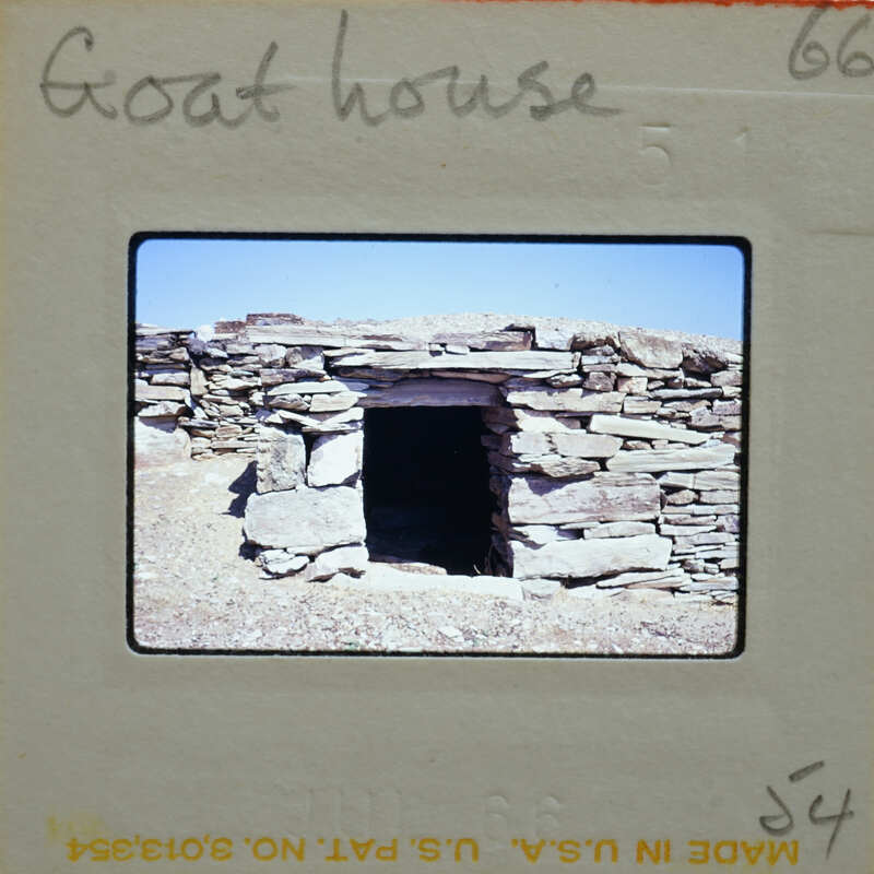 A slide of a stone structure resembling an old building or ruins.