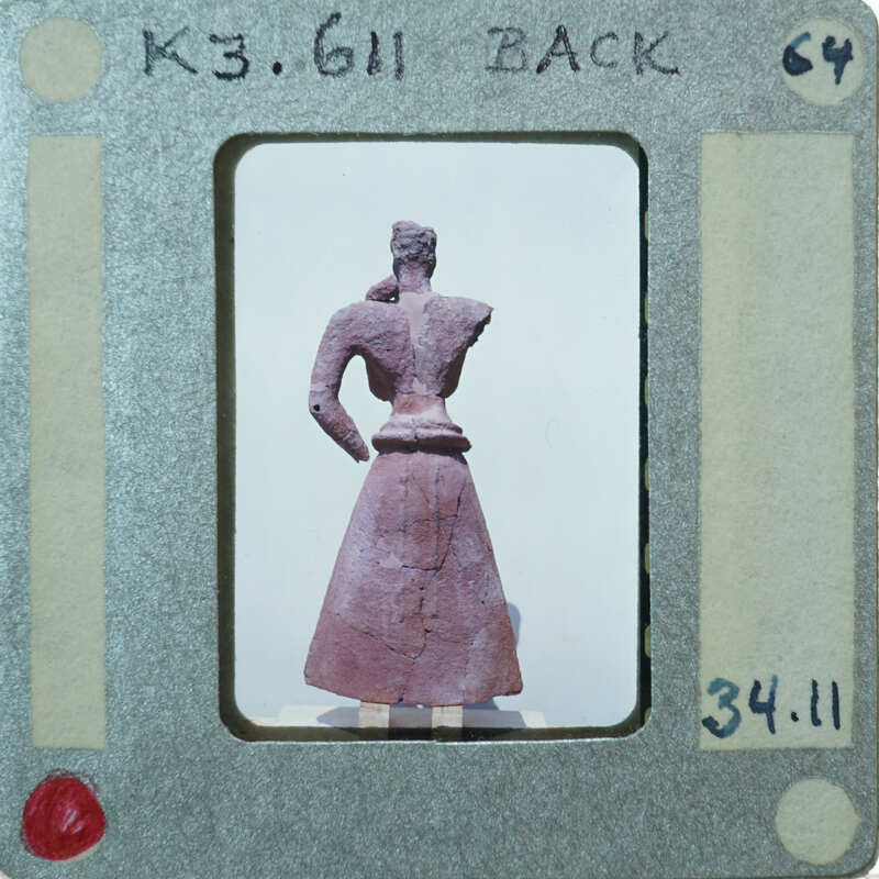 Almost complete terracotta figurine from the back minus right arm.