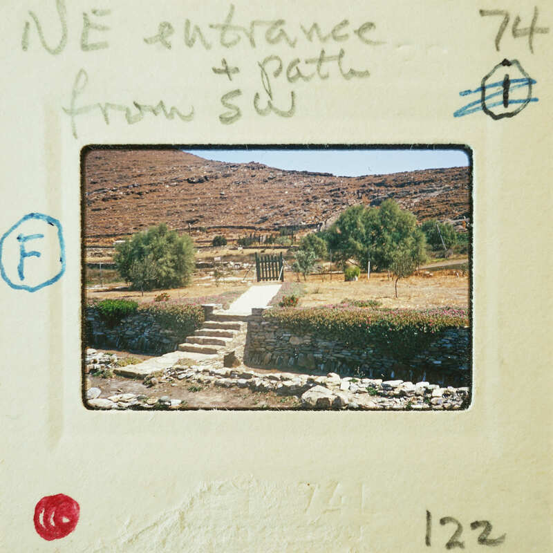 A vintage photograph of a stone staircase leading to a mountainous landscape, with handwritten annotations on the border.