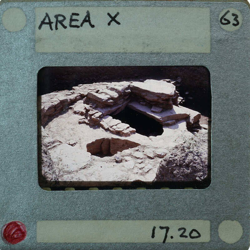 The image is a photograph of an ancient archaeological site, possibly a cave or rock shelter with stone structures and artifacts, presented on a film strip card labeled "Area X" with a price tag of £17.20.