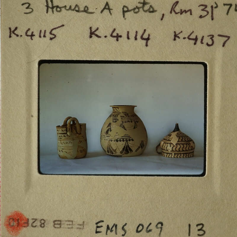 Three decorative vases with different designs and sizes on display.