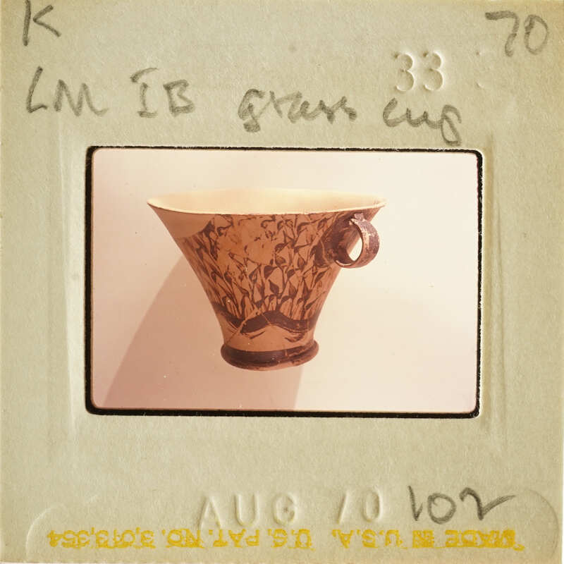 Vase with floral design on white background.