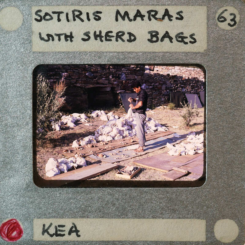 Picture of a man working with cloth bags of pottery sherds.