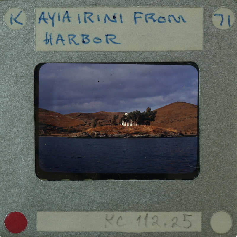 Picture of a harbor with a house on an island.