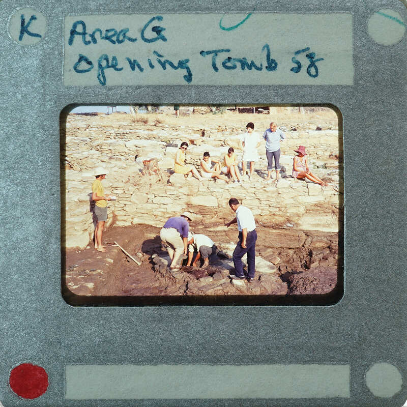 A vintage photo of archaeologists at a dig site with handwritten notes on the border.
