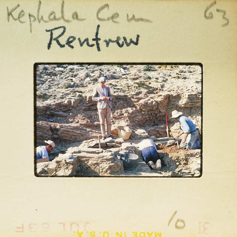 A group of archaeologists working at a site, digging and examining ancient ruins.