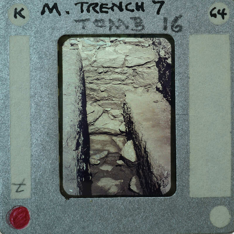 A vintage film strip with a photo of an underground tunnel or cave.