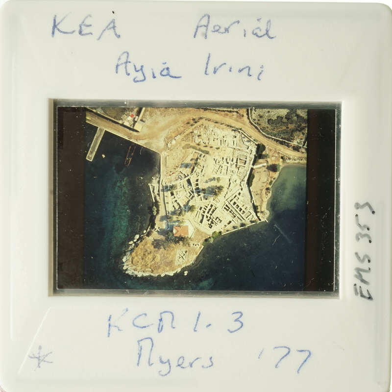 Aerial photograph of an island with buildings and water, dated 1977.