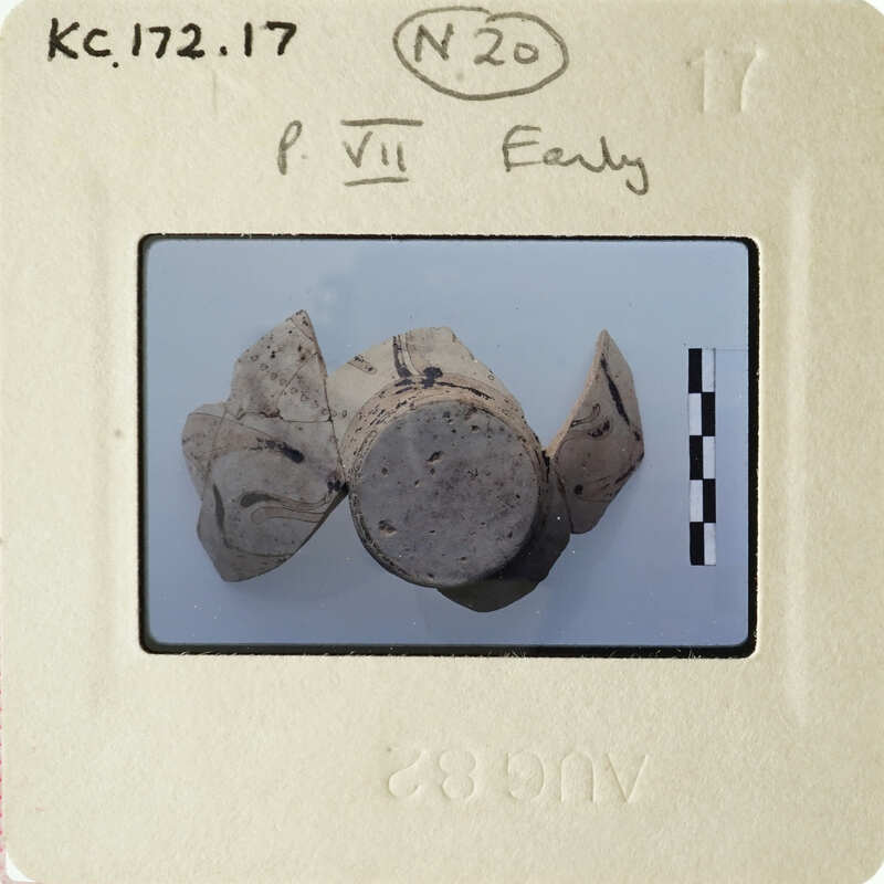 Old photograph of ancient pottery with markings on a white background.