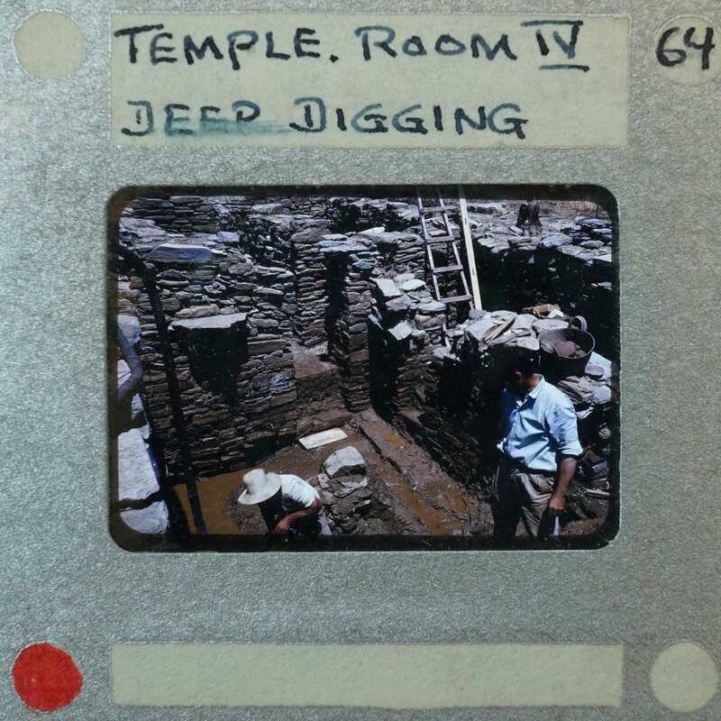 A slide of an archaeological site with ruins and workers, labeled as "Temple Room VI."