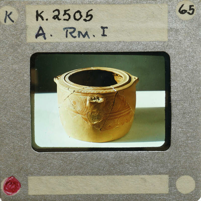 Reassembled clay pot (K.2505) with a broken handle.