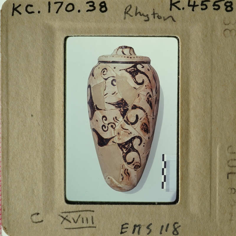 Ancient vase with intricate designs on display.