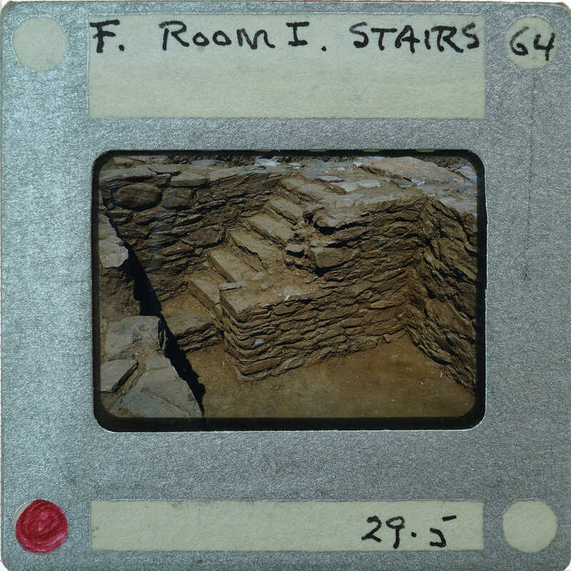 A photograph of a stone staircase on an old film strip with handwritten labels and numbers.