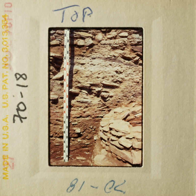 Image shows a ruler placed on top of an archaeological site, indicating scale, with a note "TOP" and a date stamp "07-18-96."