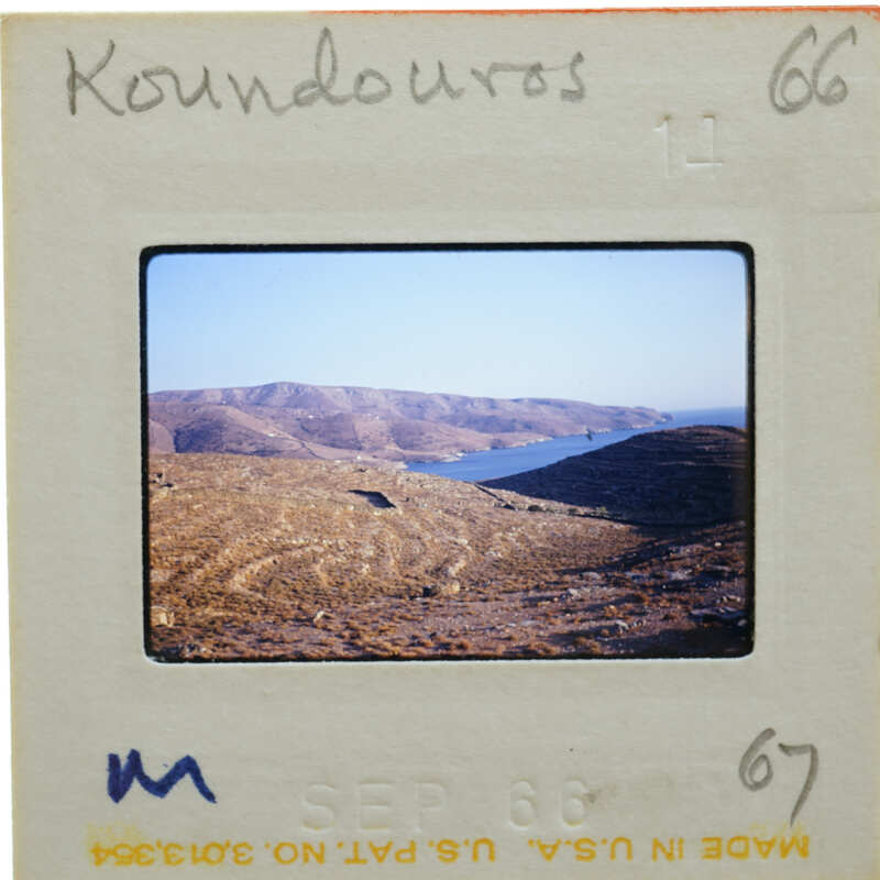 A slide with a photograph of a mountainous landscape and body of water.