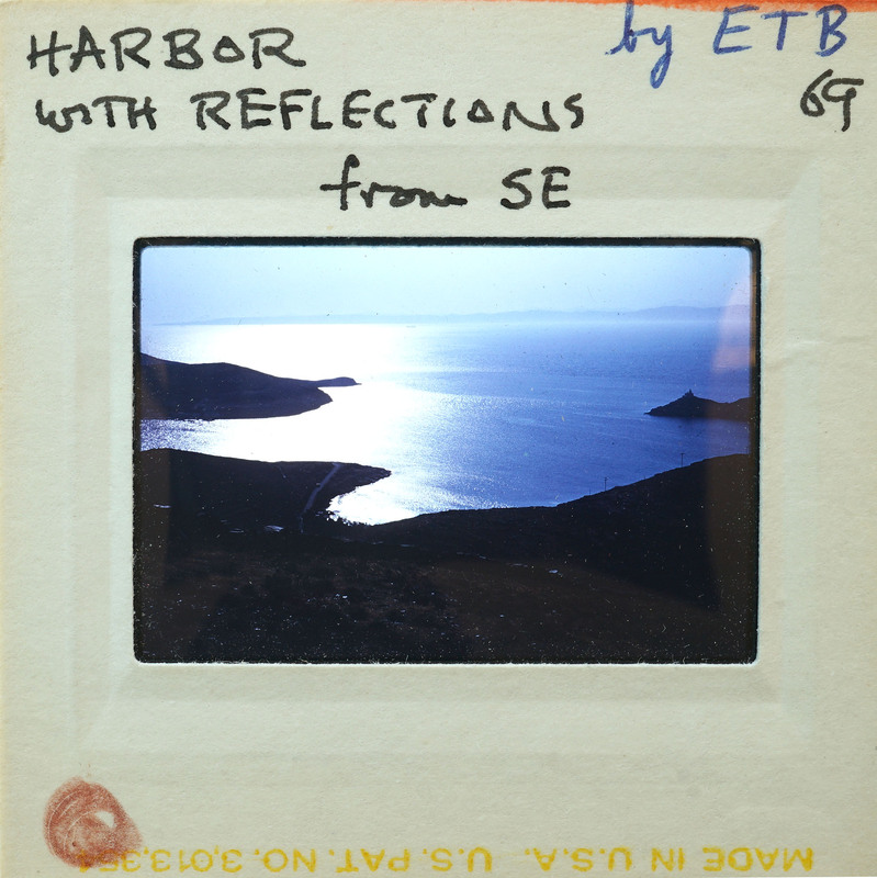 Serene harbor scene with coast and water.