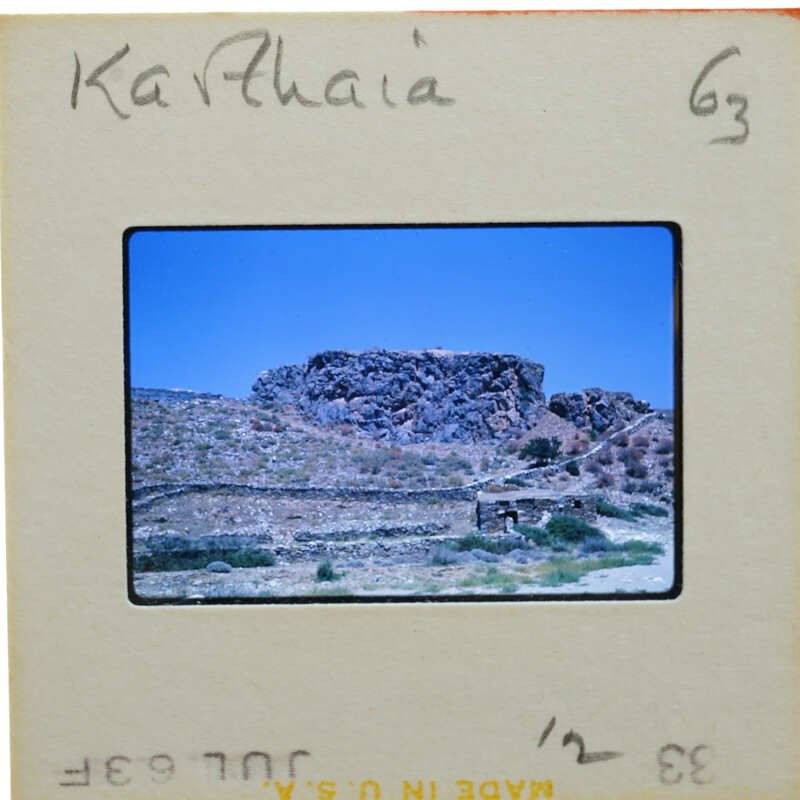 A slide of a rocky landscape with a handwritten name on the border.