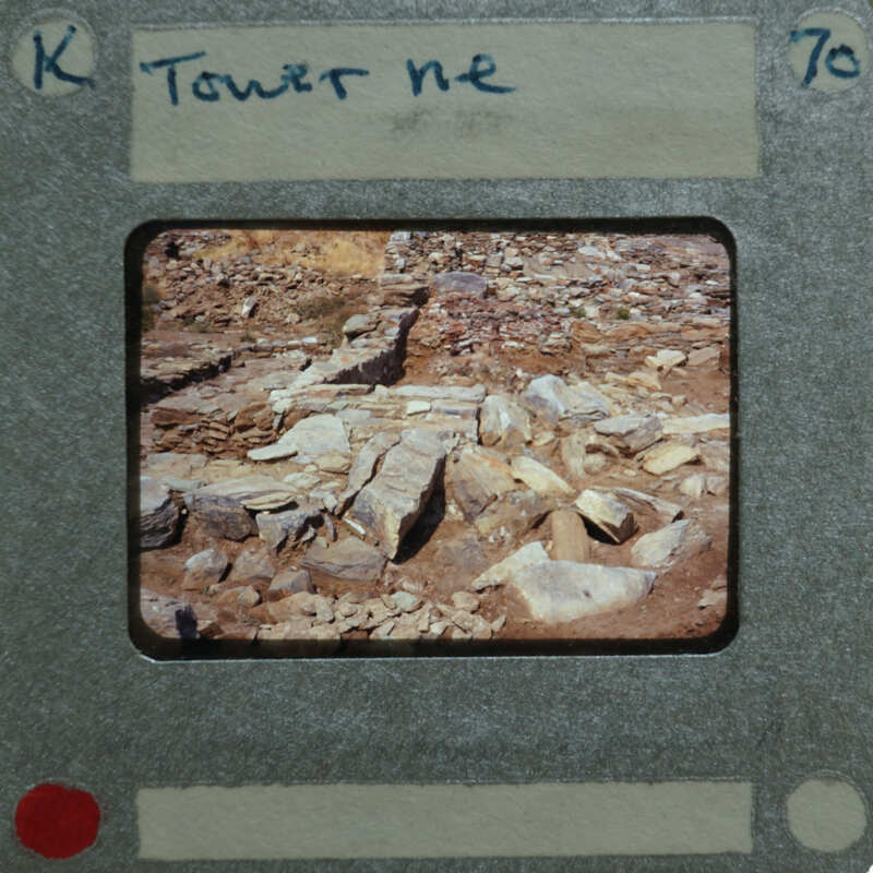 An old film strip with a picture of rocks and dirt on it.