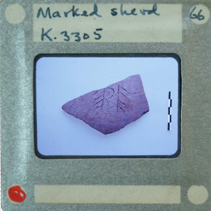 A photograph of a stone with an engraved design, displayed on a film strip card labeled "K.3805".