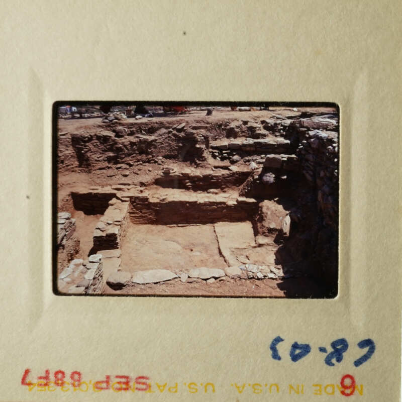 This photo depicts an ancient, abandoned stone structure with remnants of walls and foundations.